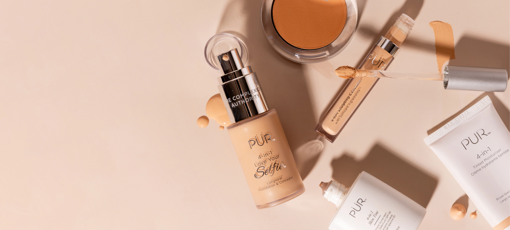 PÜR Anniversary Sale 2026 - 35% Off Sitewide: Various makeup bottles and containers laying against cream background