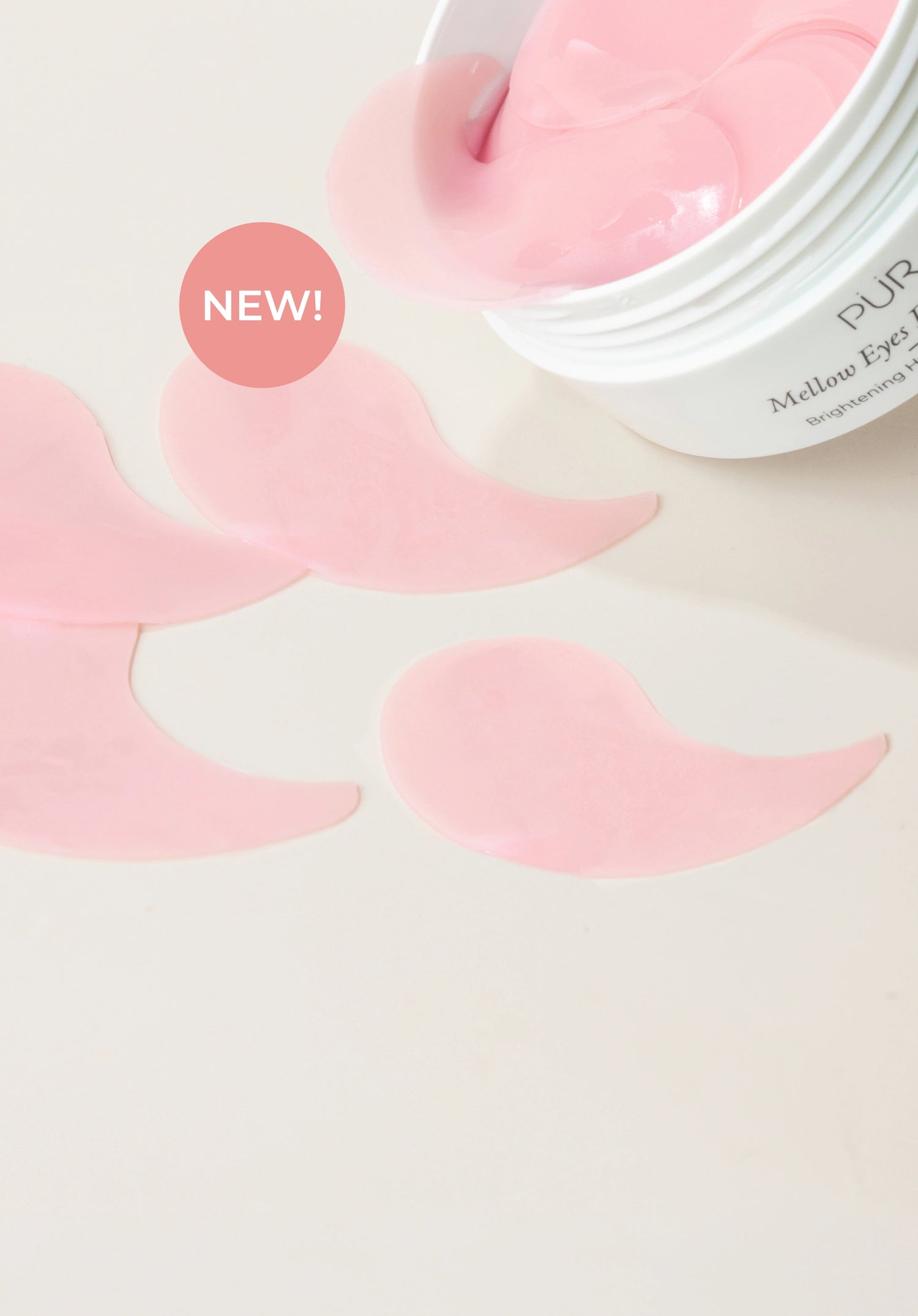 Mellow Eyes Dragonfruit: Open container spilling out pink eye patches against cream background (mobile)