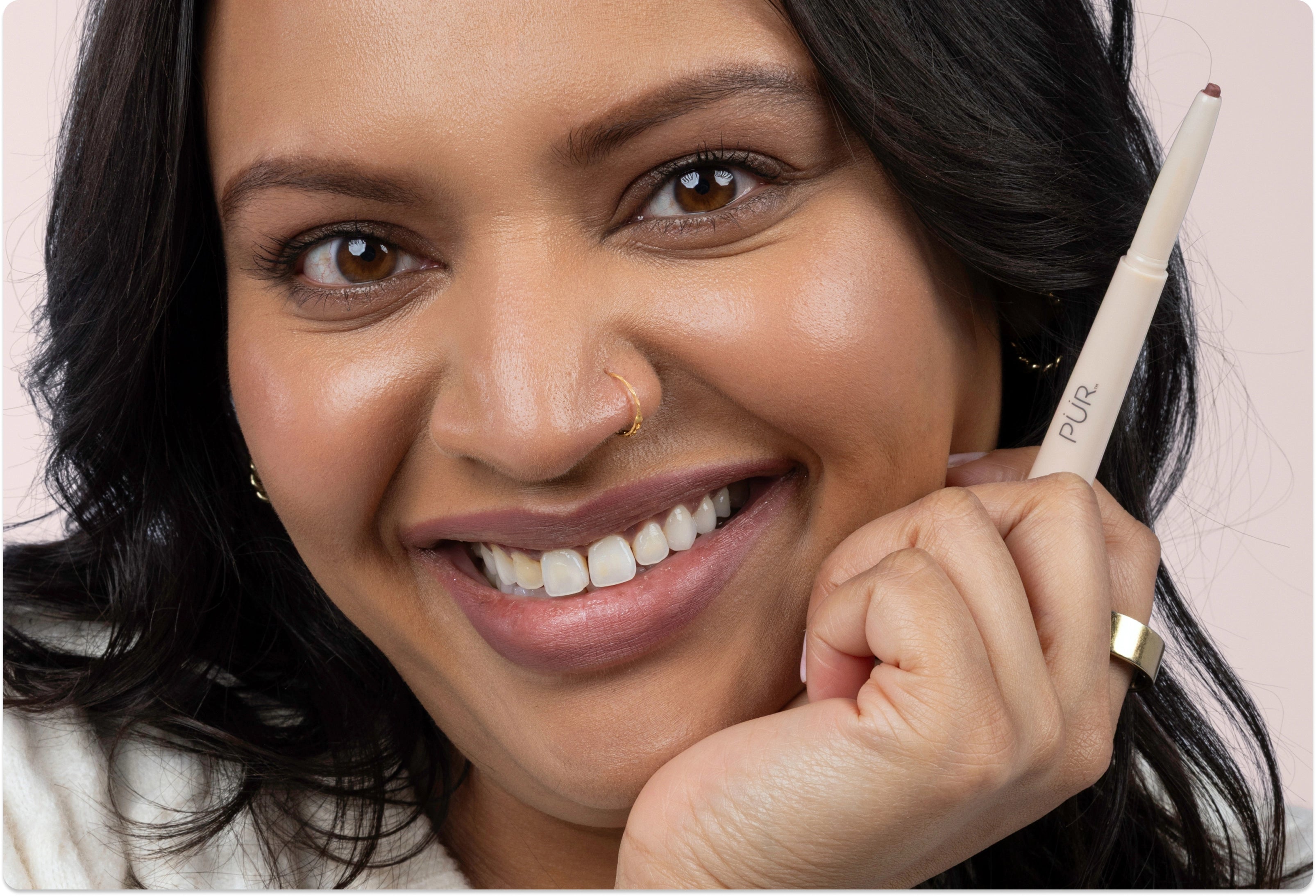 National Lipstick Day: 40% Off Lipstick - Woman wearing Silky Sculpt and smiling against pink background