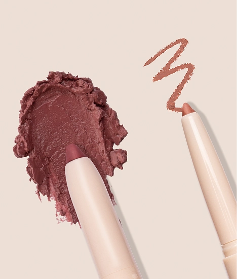 Silky Sculpt - Fine tipped lip liner and ultra smooth cream lipstick, dragging down to reveal swatch on both sides against cream background (diagonally from bottom right)