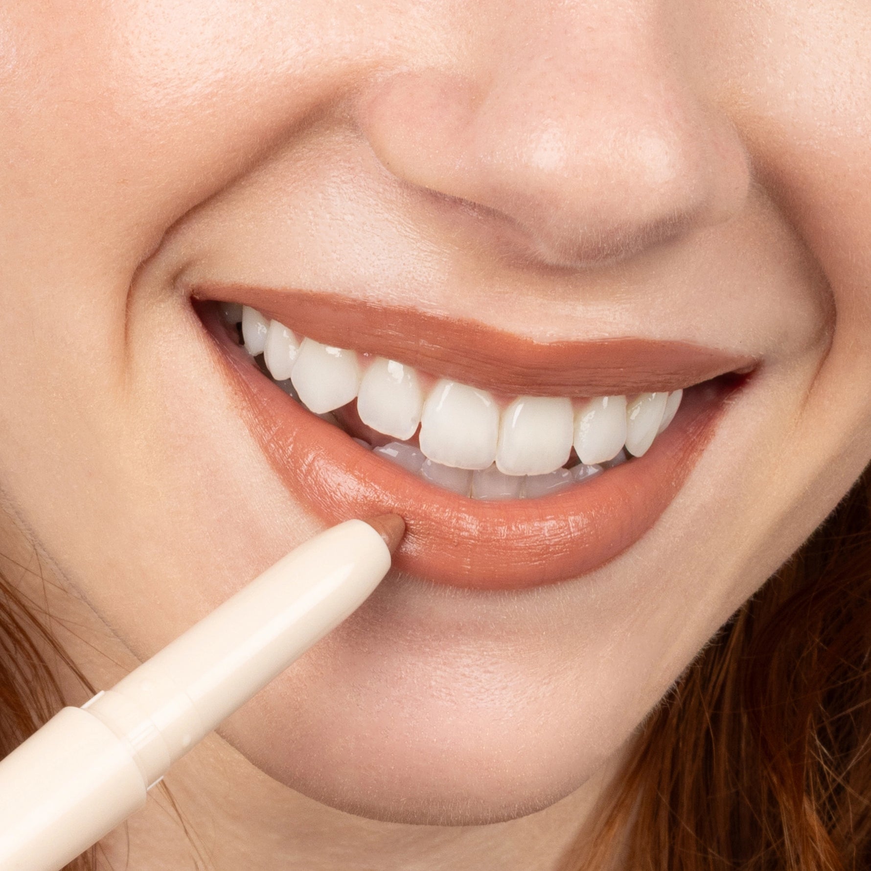 Silky Sculpt in Peach Spritz - Model applying lip liner 