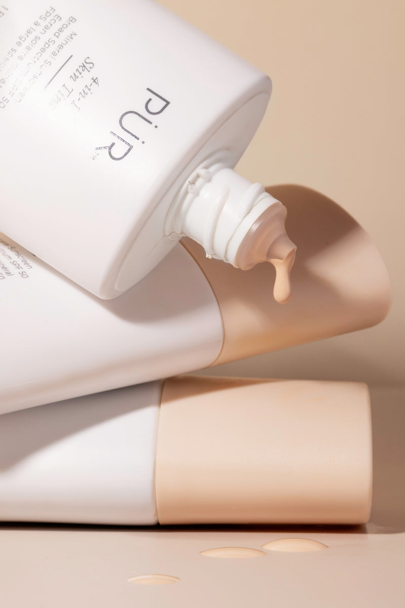 PUR Skin Tint product tubes 