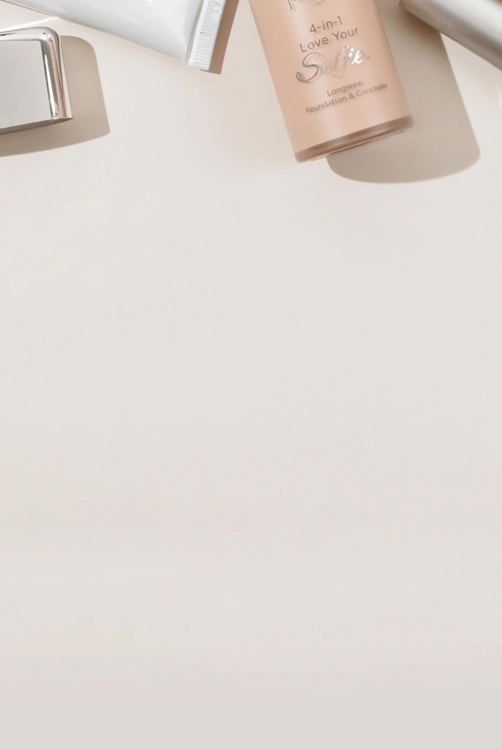 Find Your Foundation: Various PÜR complexion products laying against cream background