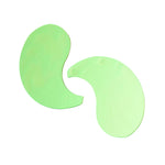 Two green hydrogel eye patches on a clean white background to show size and curved design.